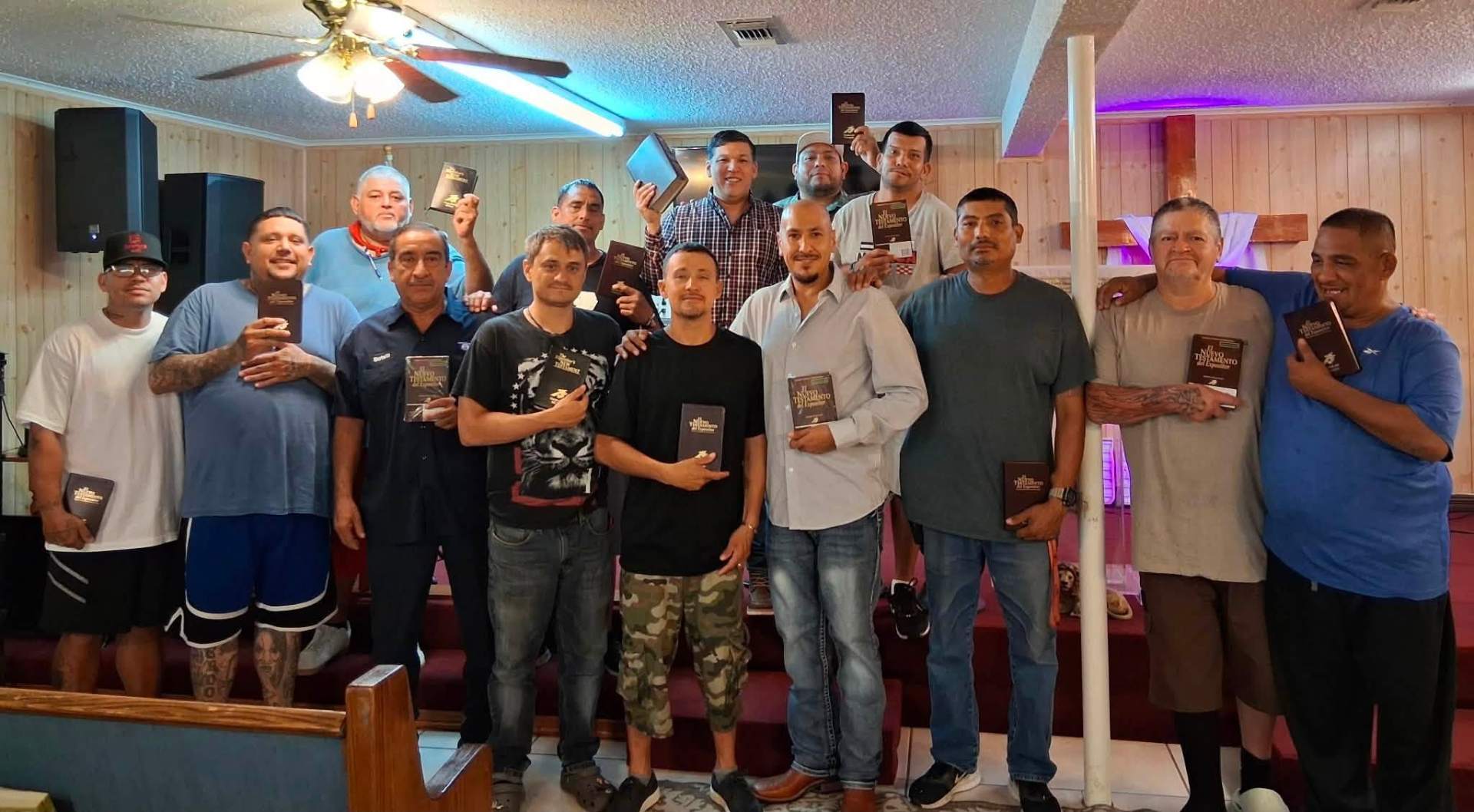 Men holding Bibles after a discipleship gathering