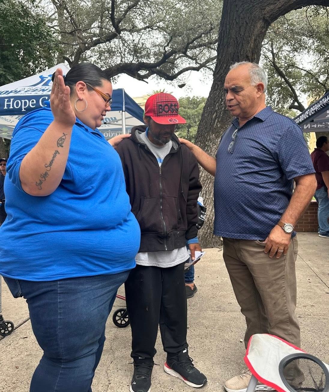 Prayer with a neighbor during street outreach